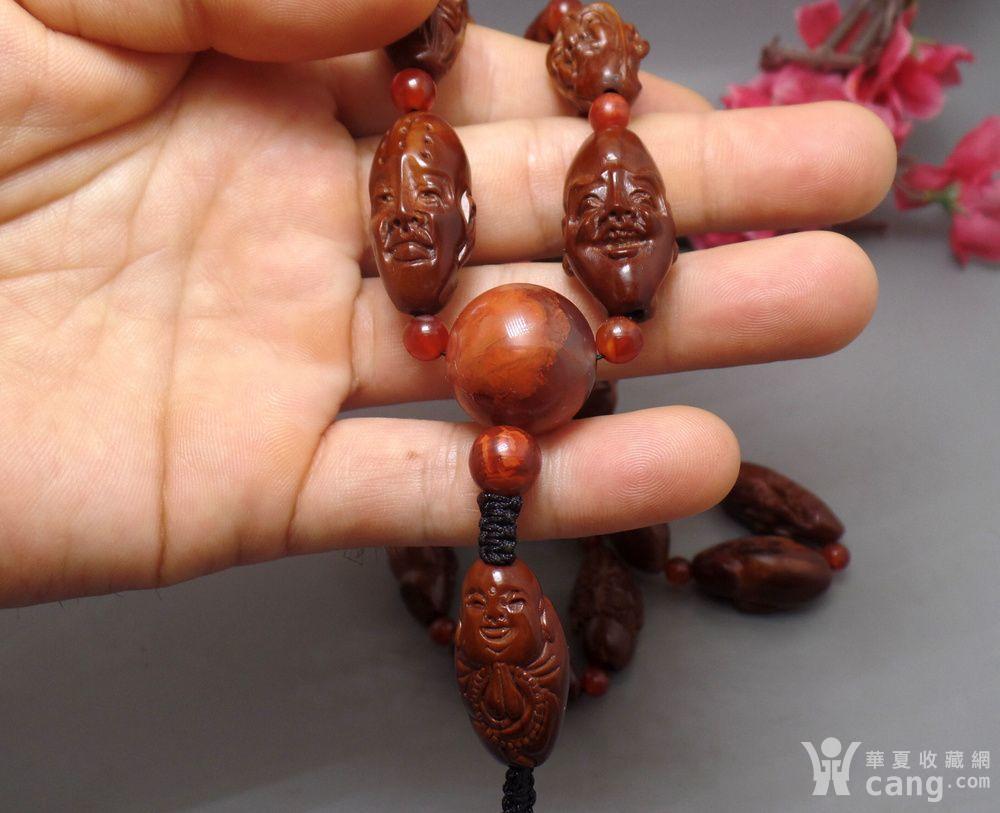 橄榄核精雕十八罗汉配四川南红玛瑙手持
